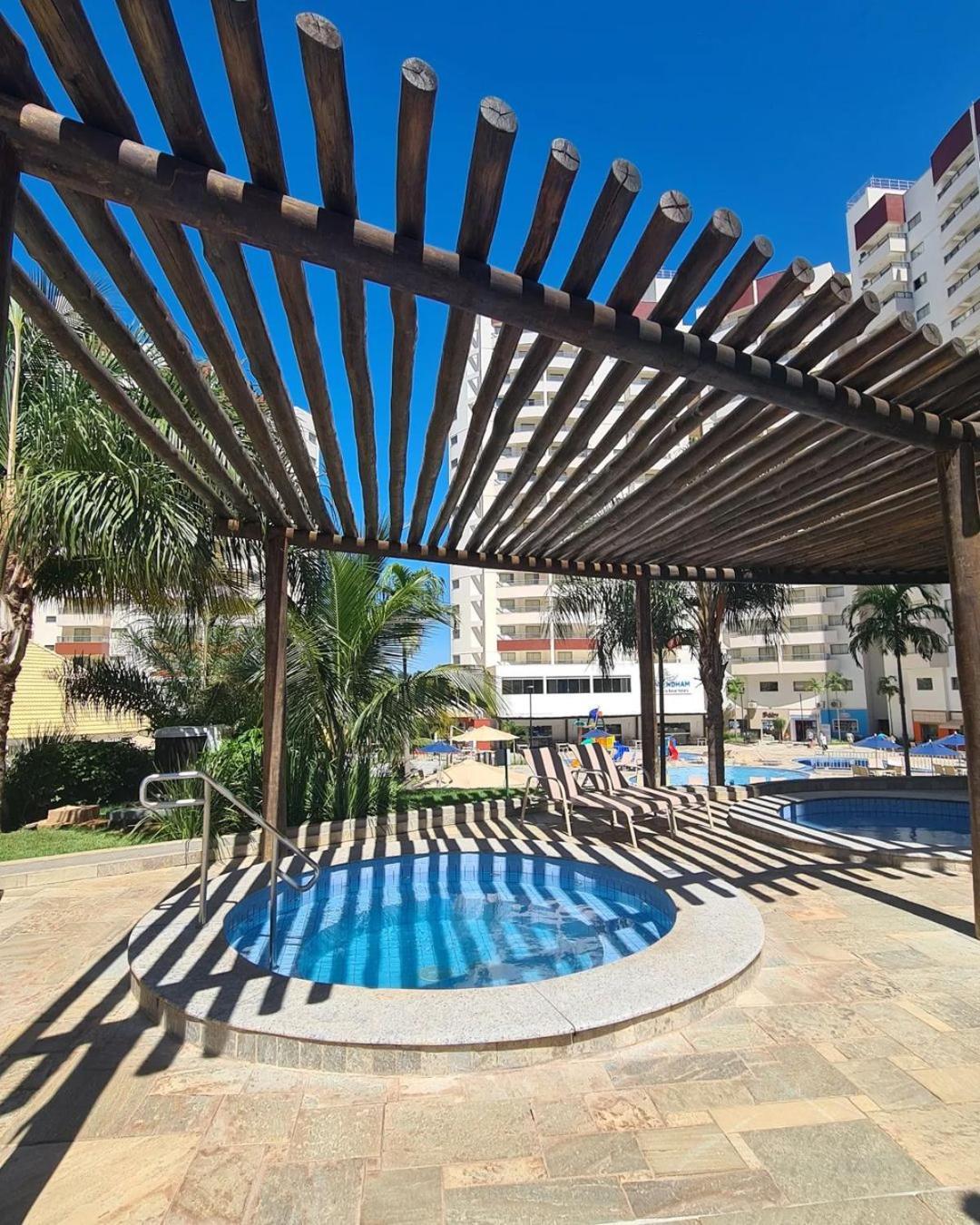 Wyndham Olimpia Royal Hotels Exterior photo A pergola in a swimming pool